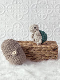 Handmade peek-a-boo turtle crochet plushie inside a crochet egg