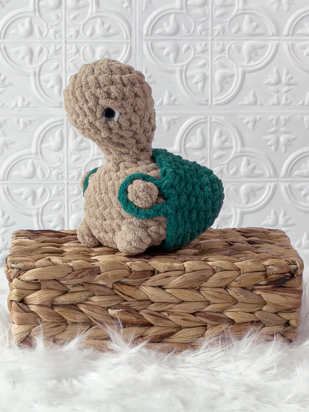 Handmade turtle crochet plushie shown from the front