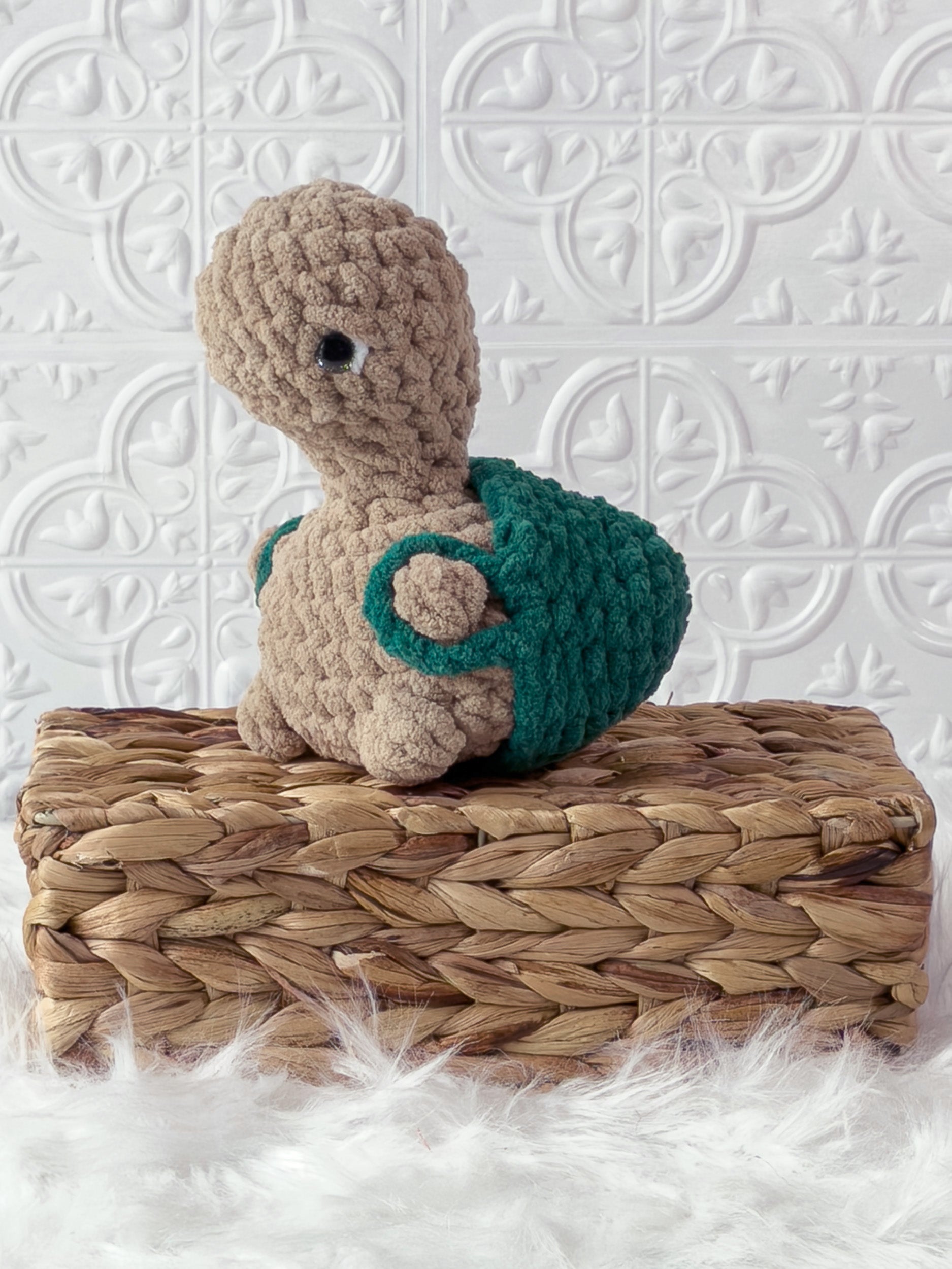 Handmade turtle crochet plushie shown from the front