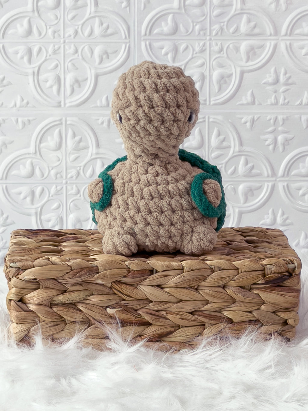Handmade beige, dark turtle crochet plushie shown from the front