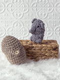 Handmade peek-a-boo elephant crochet plushie inside a crochet peanut