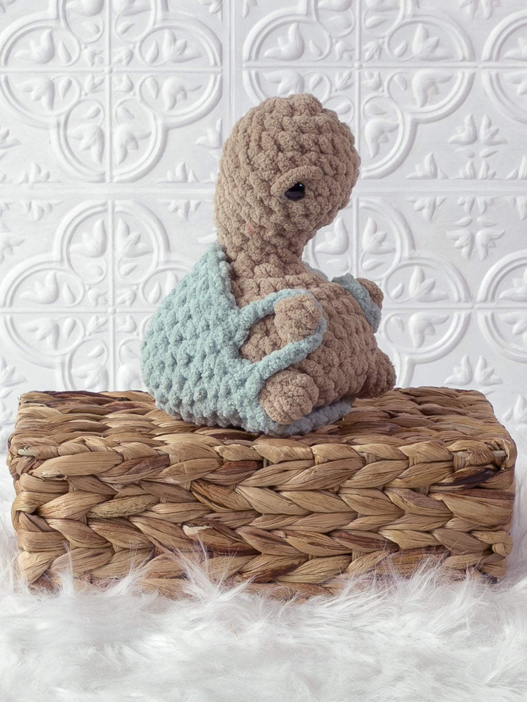 Handmade beige, light turtle crochet plushie shown from an angled view