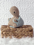 Handmade turtle crochet plushie shown from the front