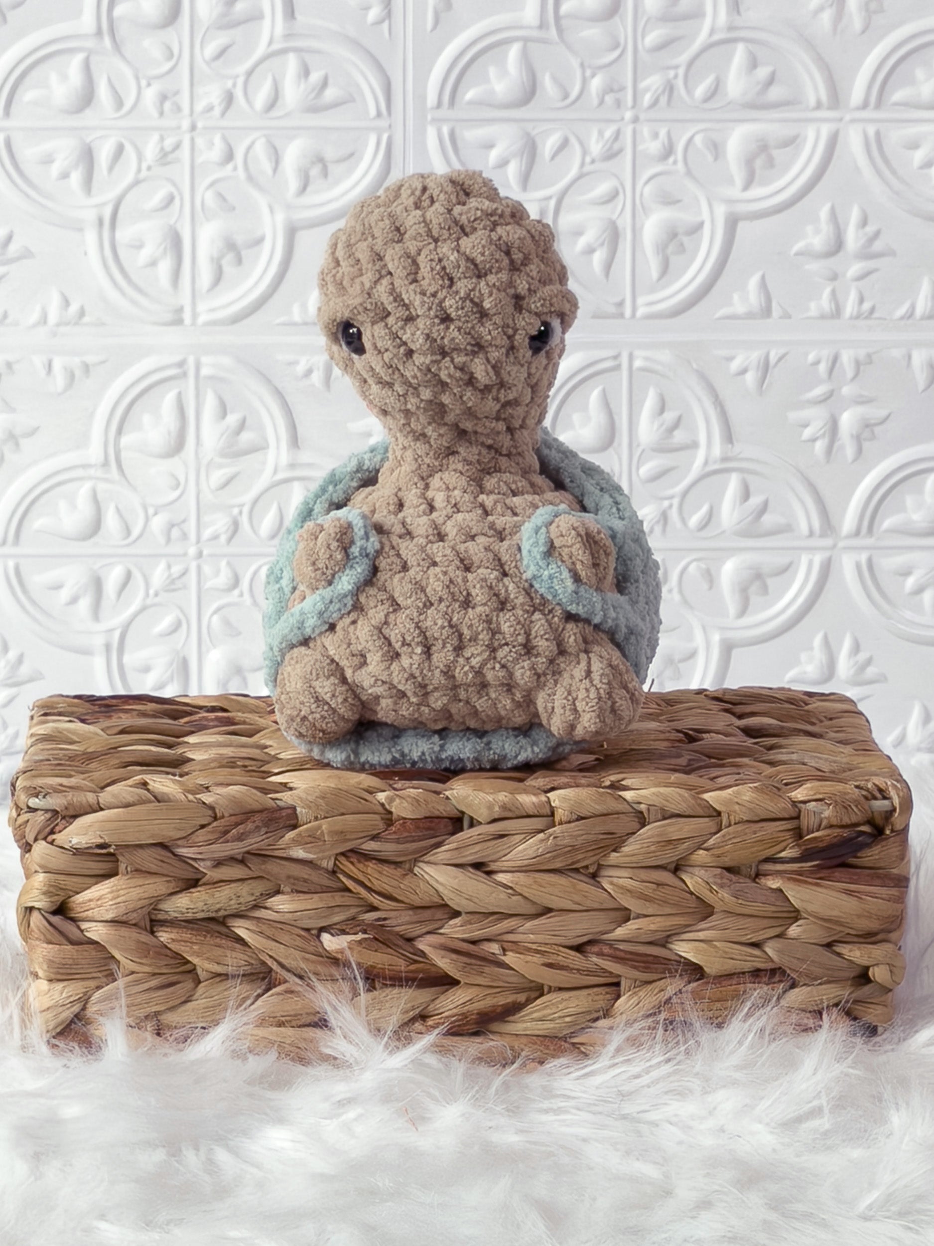 Handmade beige, light turtle crochet plushie shown from the front