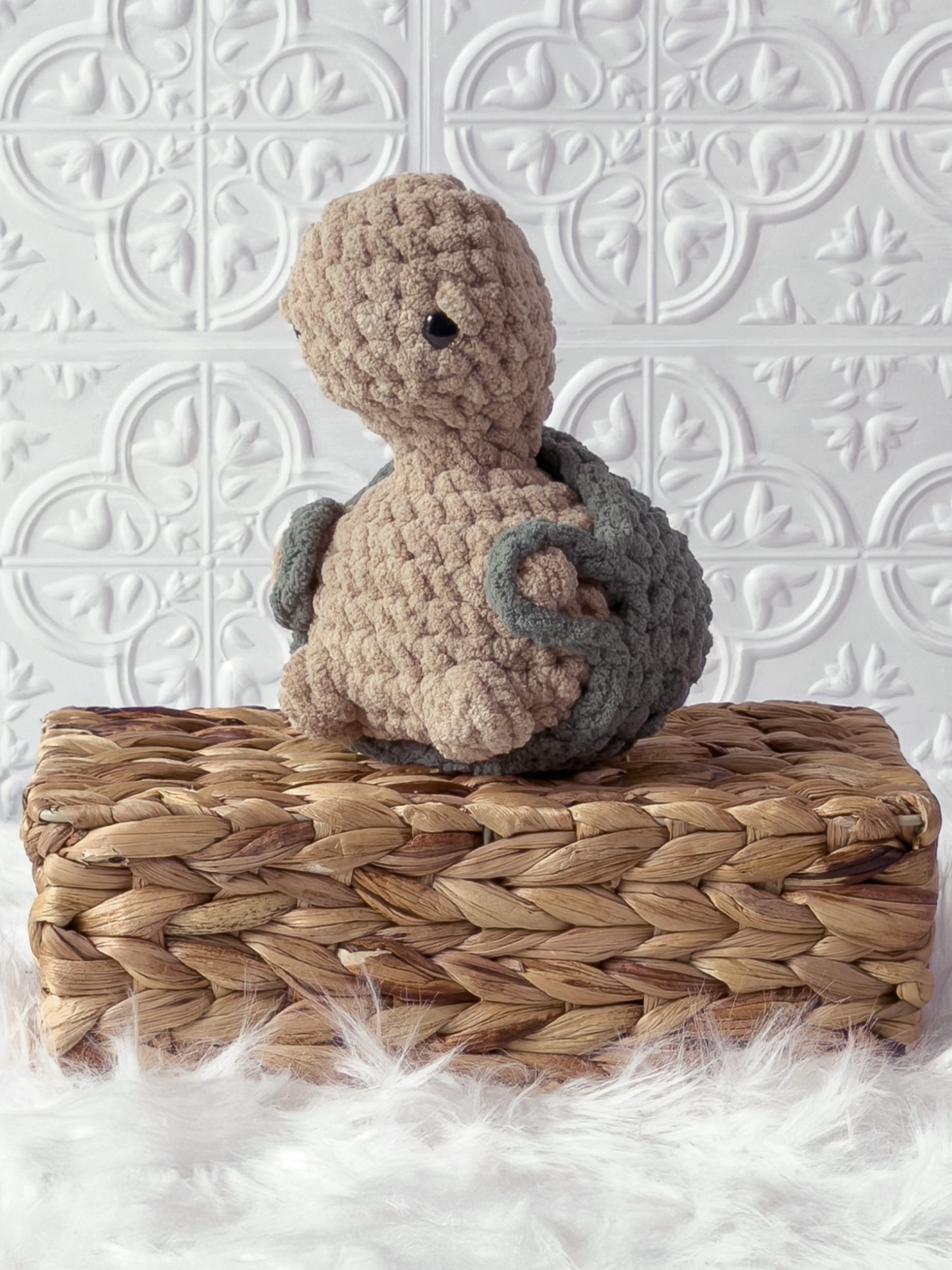 Handmade turtle crochet plushie shown from the front