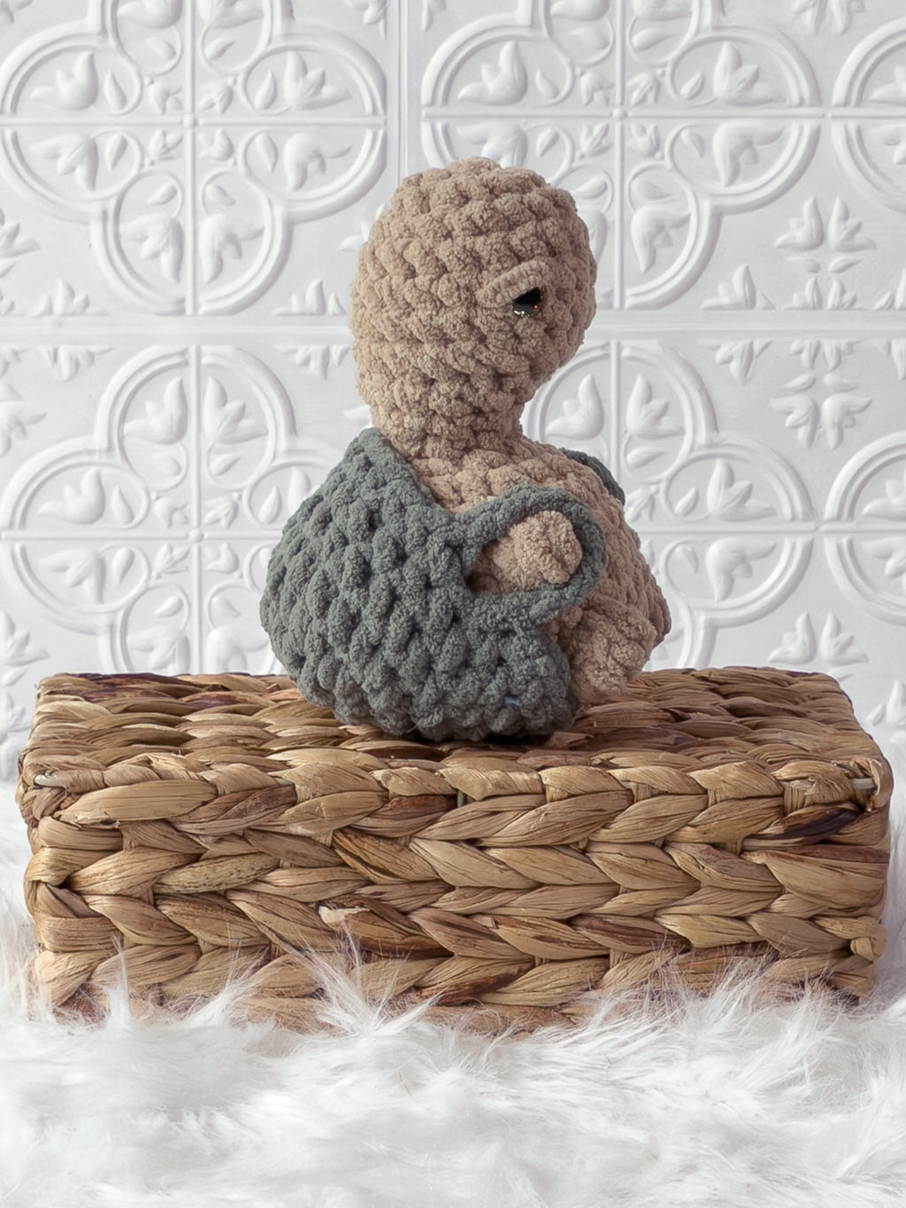 Handmade beige, medium turtle crochet plushie shown from the side