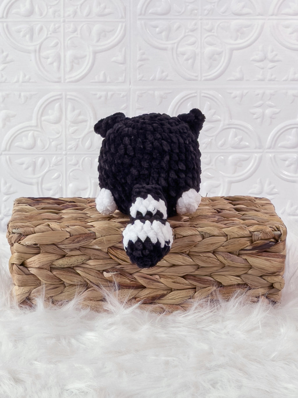 Handmade black kitten crochet plushie shown from the back