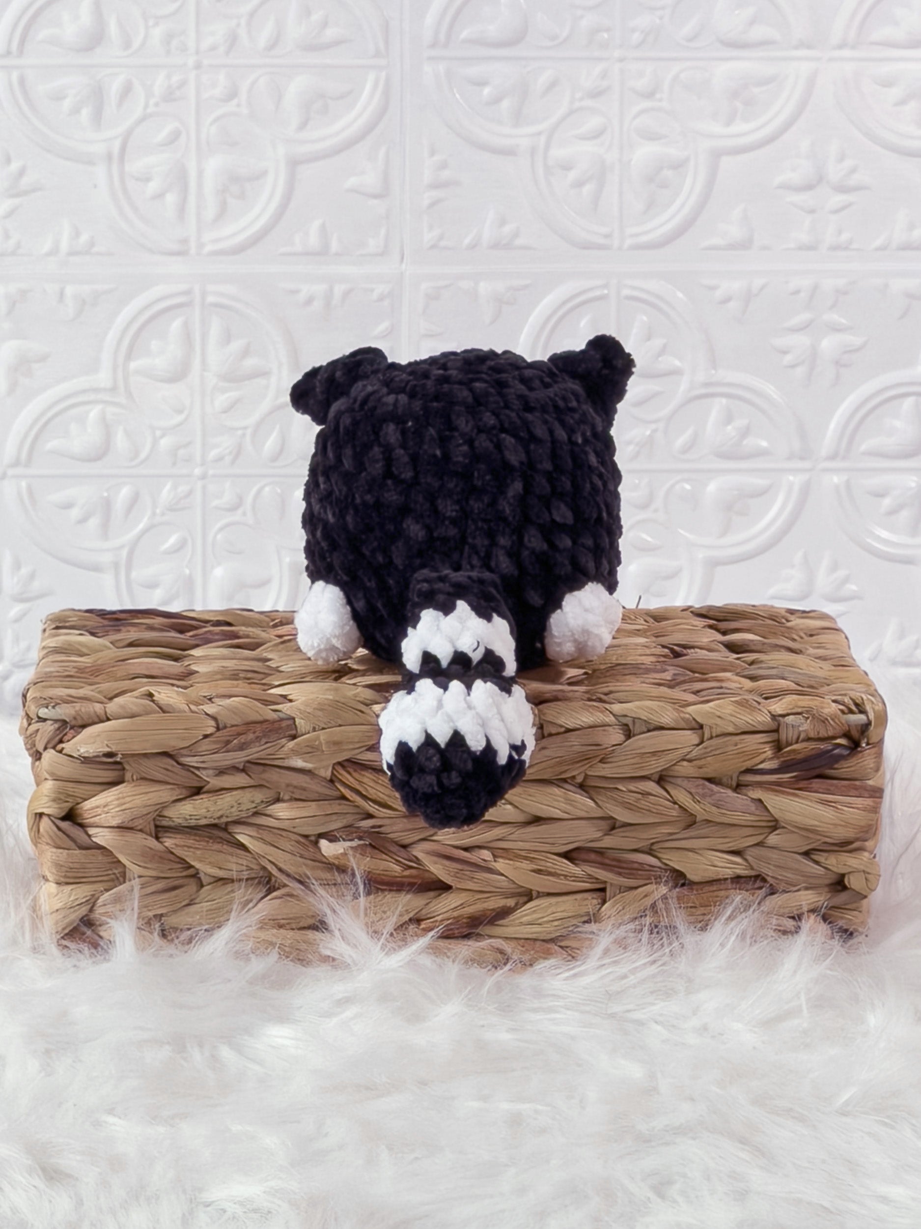Handmade black kitten crochet plushie shown from the back