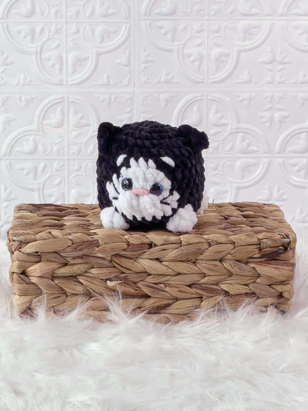 Handmade black kitten crochet plushie shown from the front