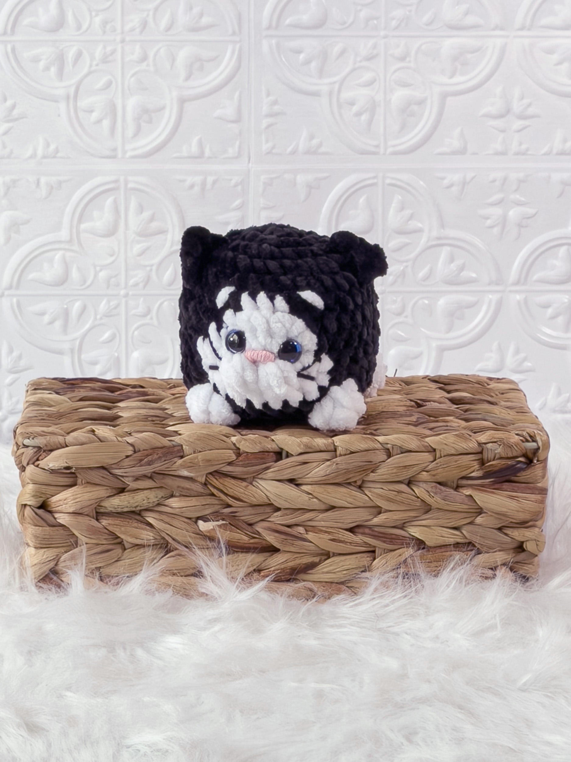 Handmade black kitten crochet plushie shown from the front