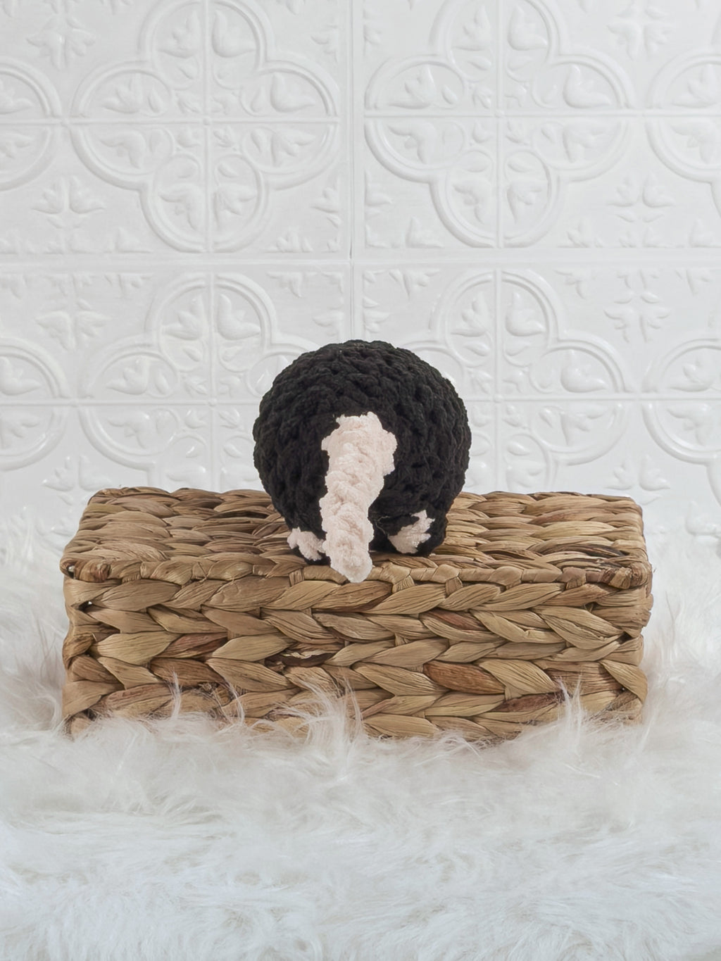 Handmade black rat crochet plushie shown from the back