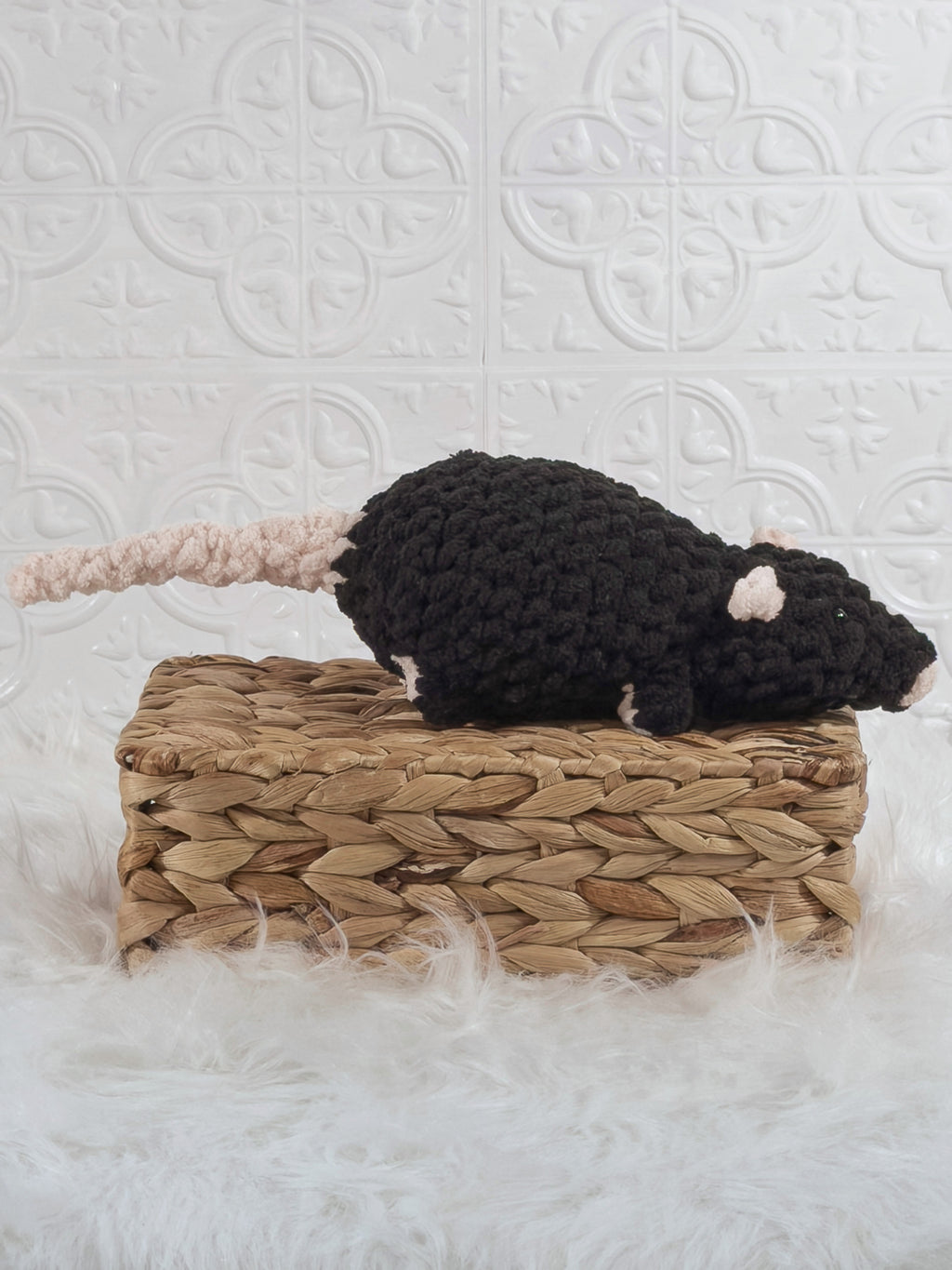 Handmade black rat crochet plushie shown from the side