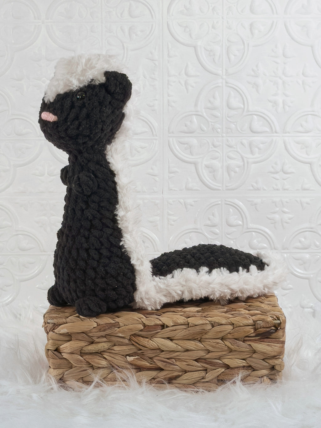 Handmade skunk crochet plushie shown from the front