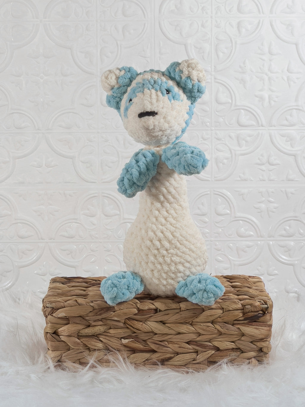 Handmade blue ferret crochet plushie shown from the front
