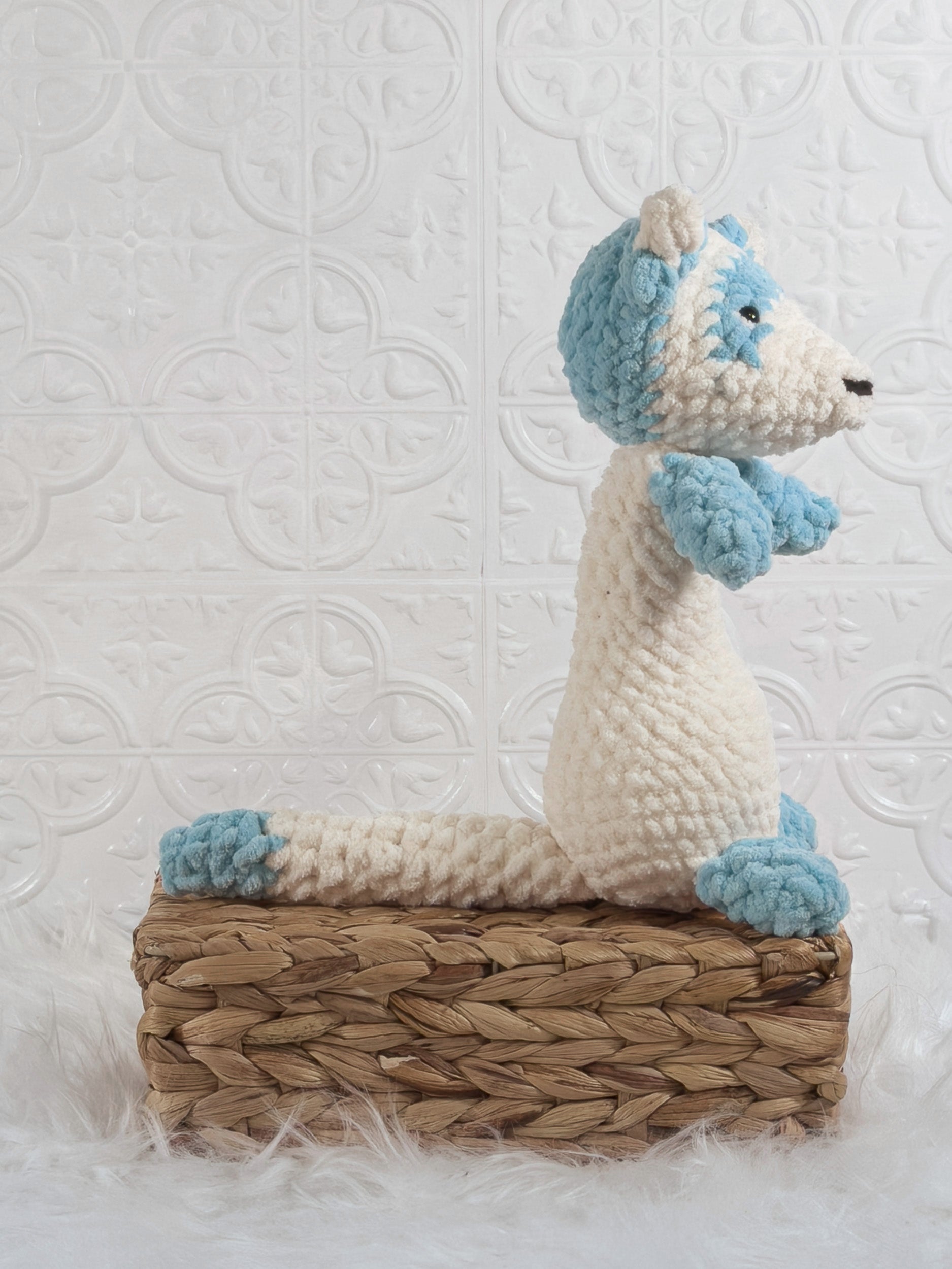 Handmade blue ferret crochet plushie shown from the side