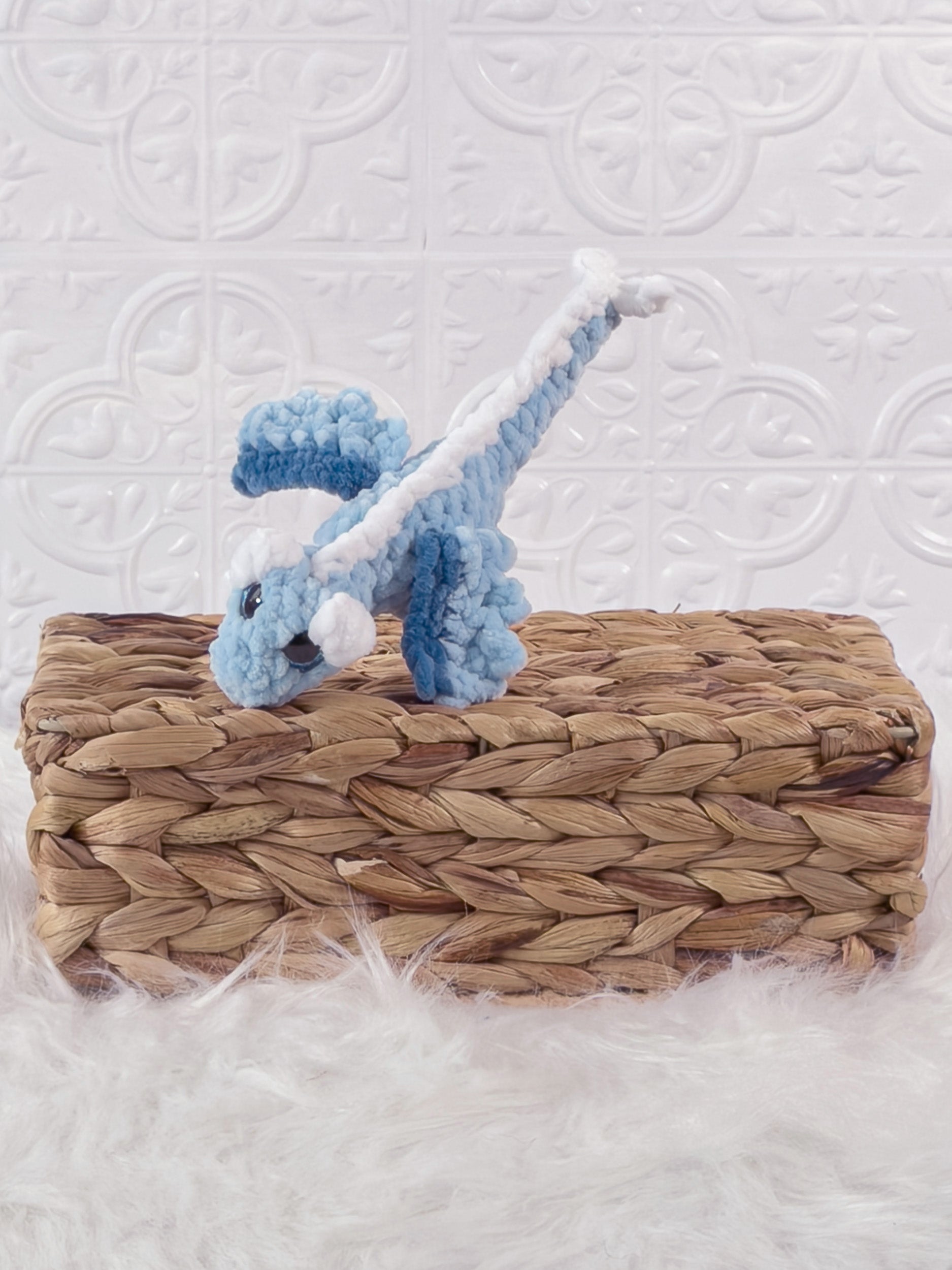 Handmade blue mini dragon crochet plushie shown from the front
