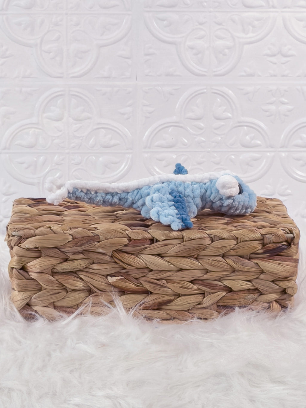 Handmade blue mini dragon crochet plushie shown from the side