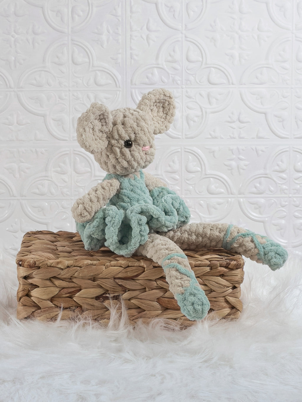 Handmade blue mouse ballerina crochet plushie shown from an angled view
