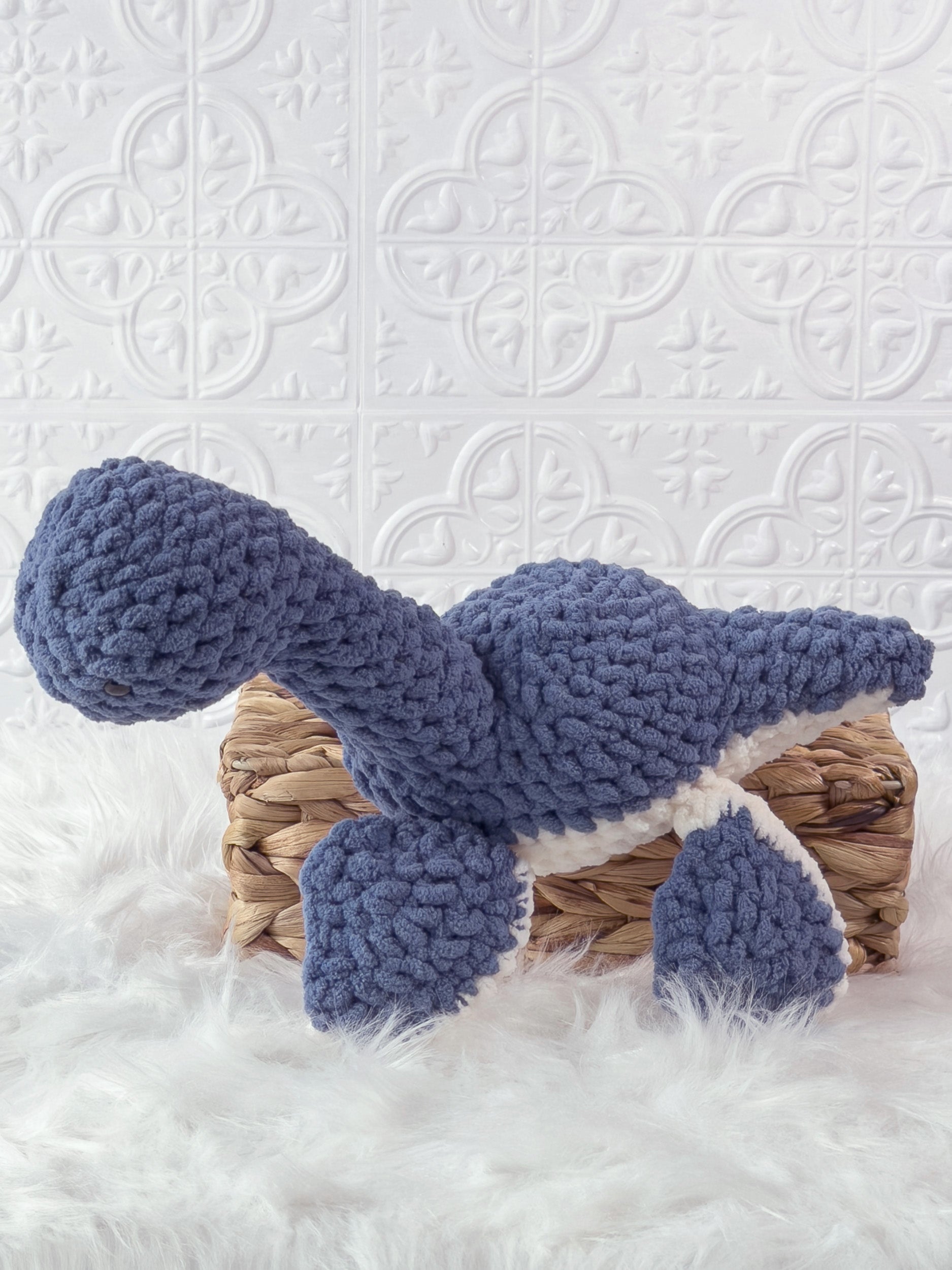 Handmade plesiosaurus crochet plushie shown from the front