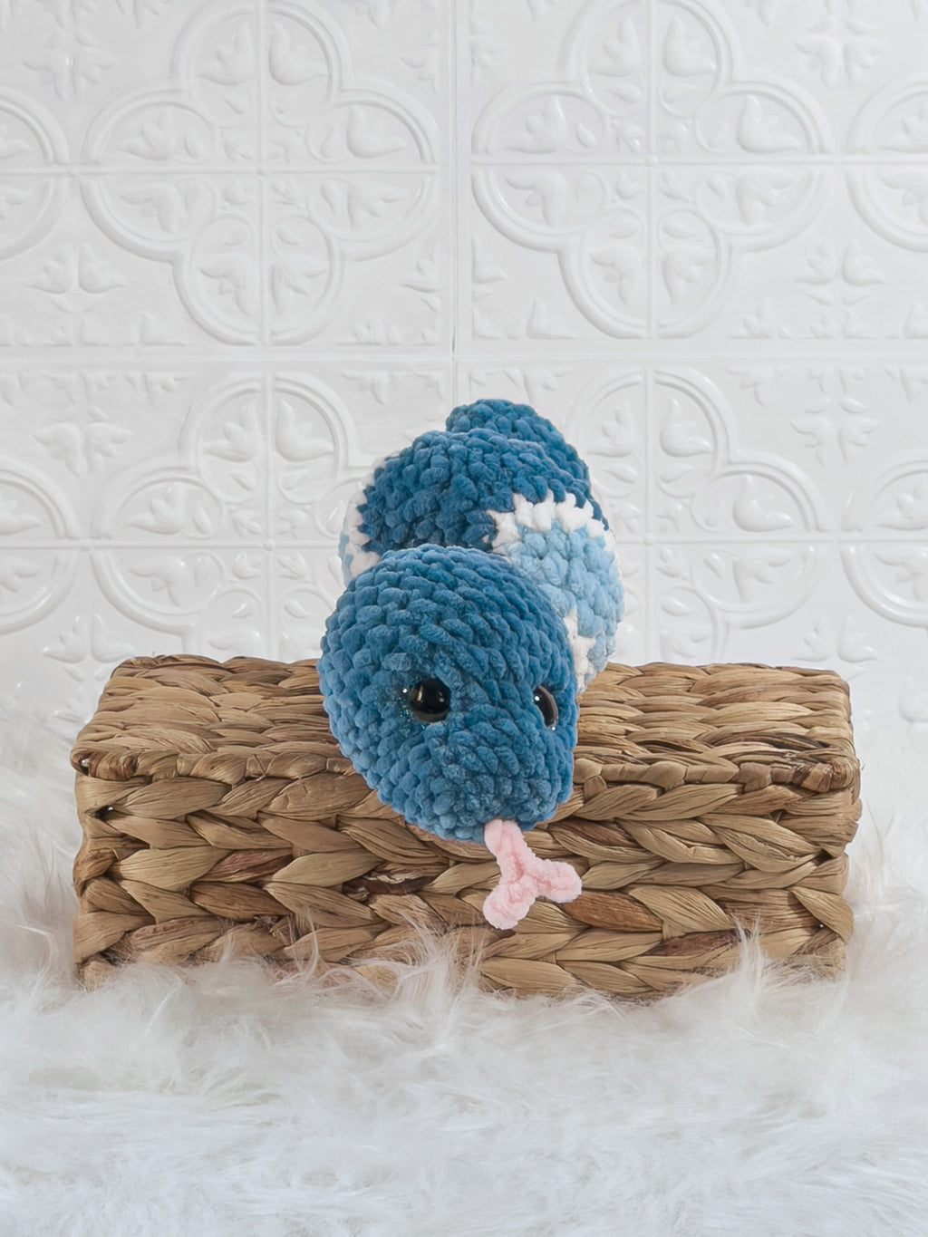 Handmade blue snake crochet plushie shown from the front