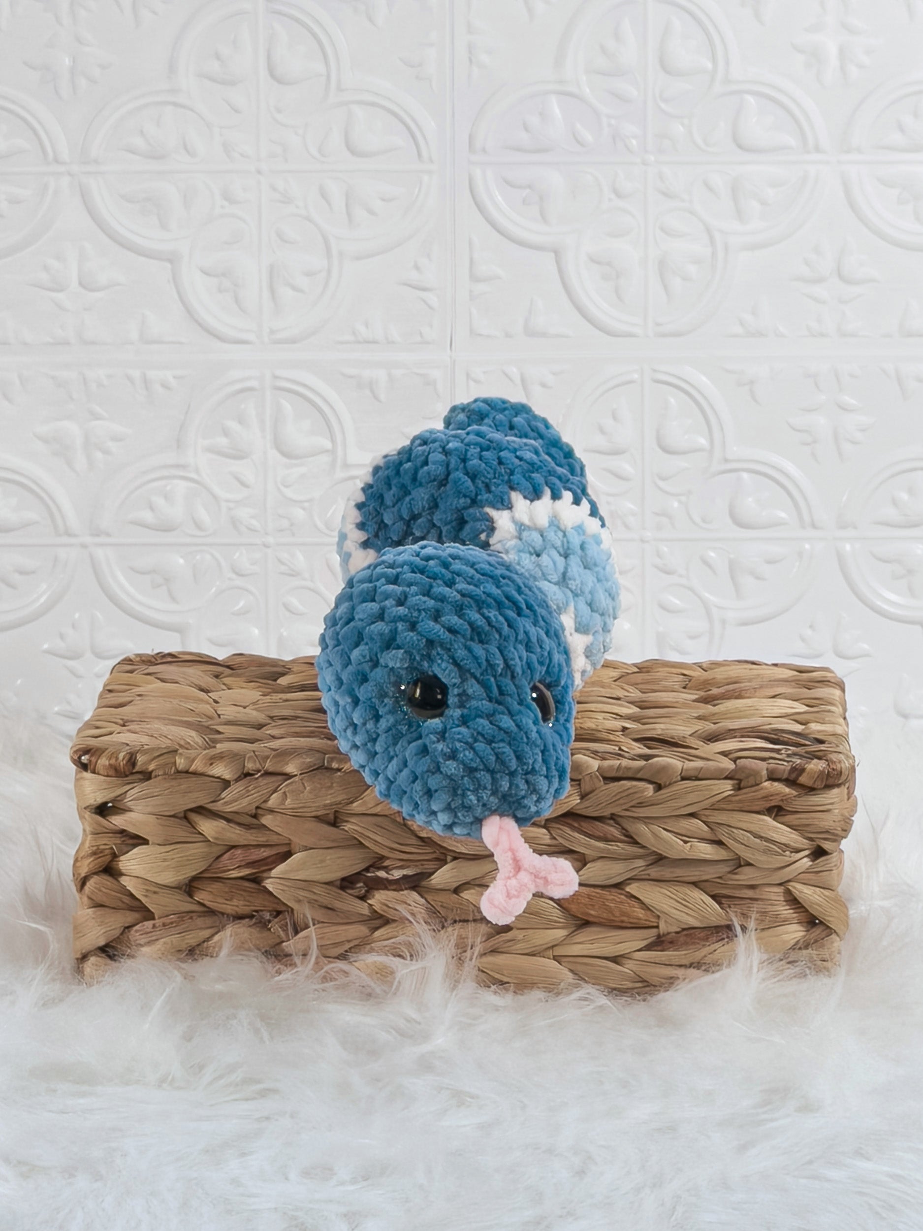 Handmade blue snake crochet plushie shown from the front
