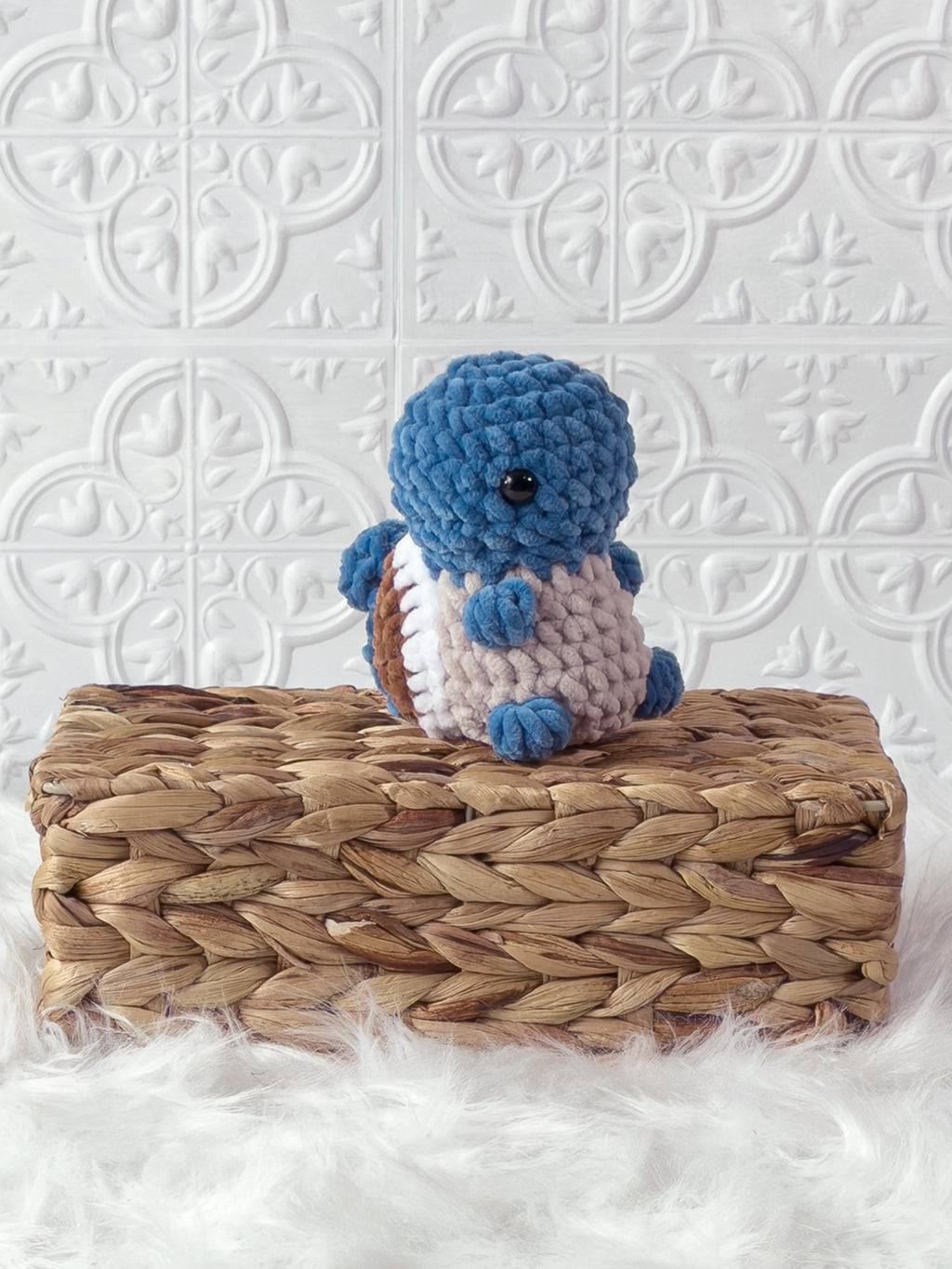 Handmade blue squirtle crochet plushie shown from an angled view