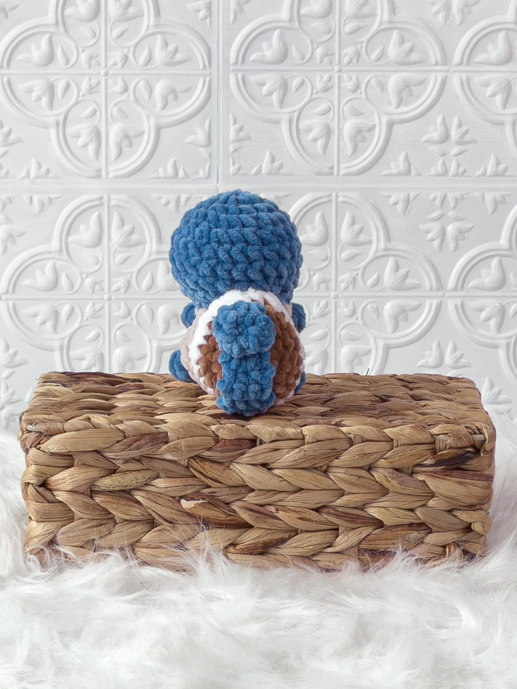Handmade blue squirtle crochet plushie shown from the back