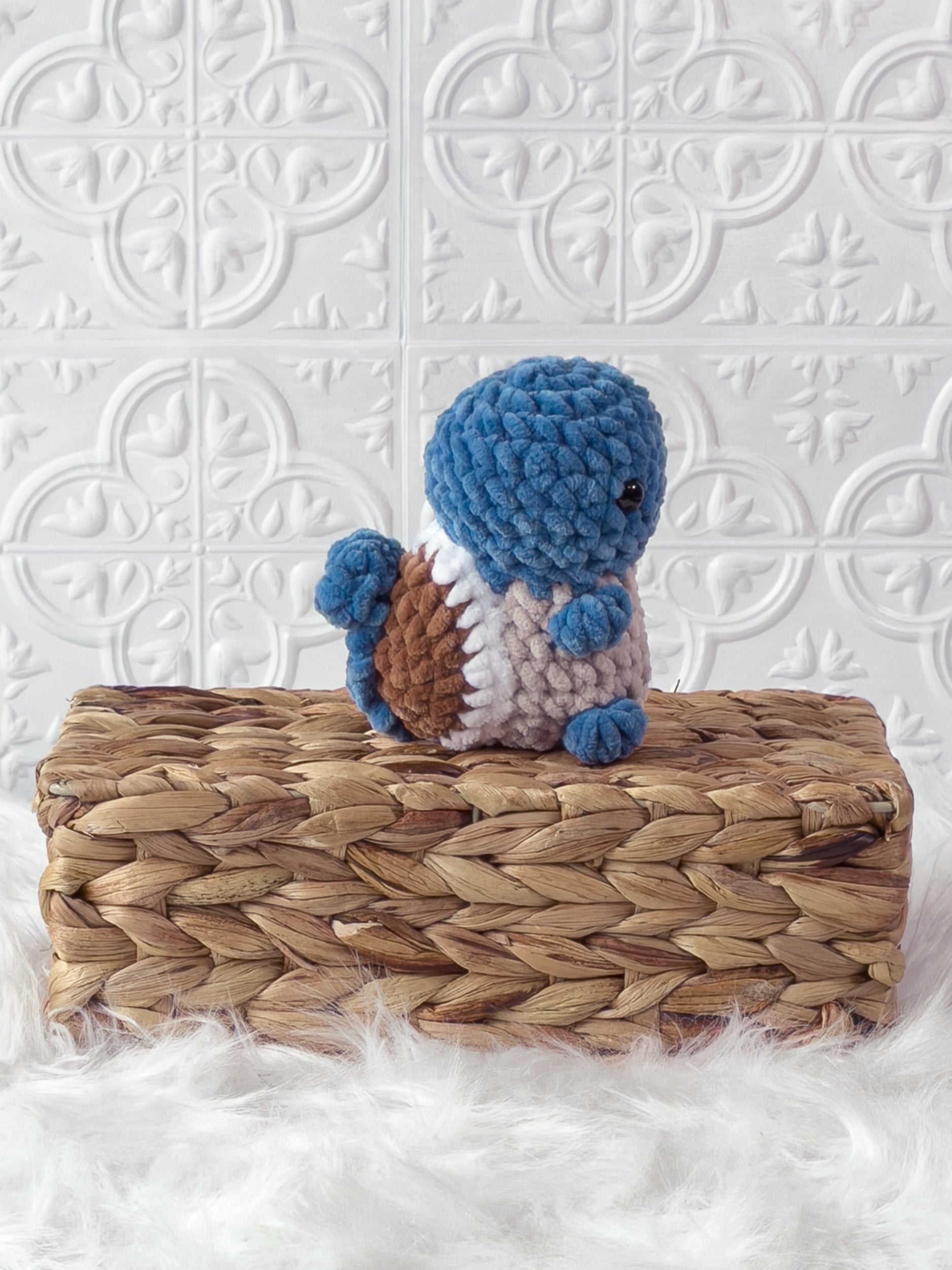Handmade blue squirtle crochet plushie shown from the side