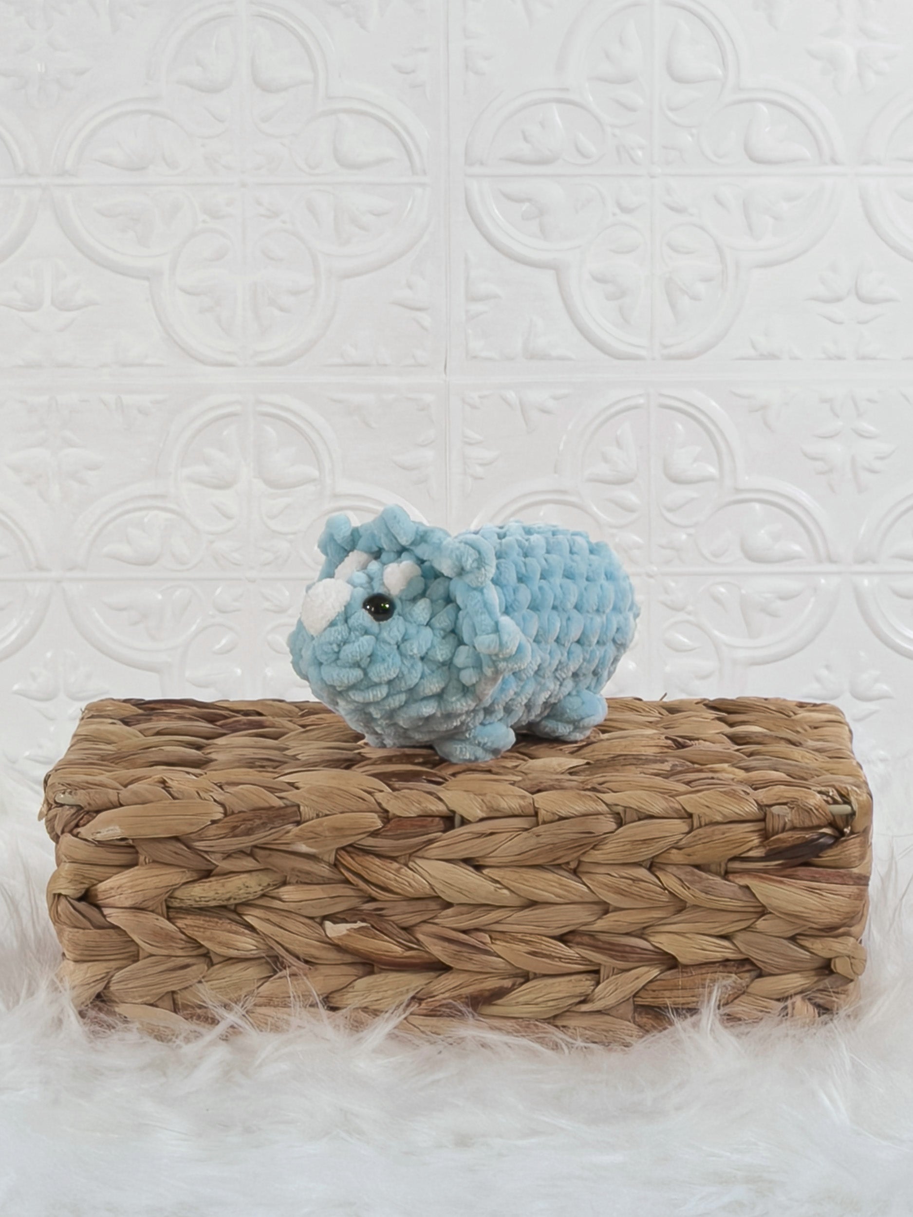 Handmade triceratops crochet plushie shown from the front