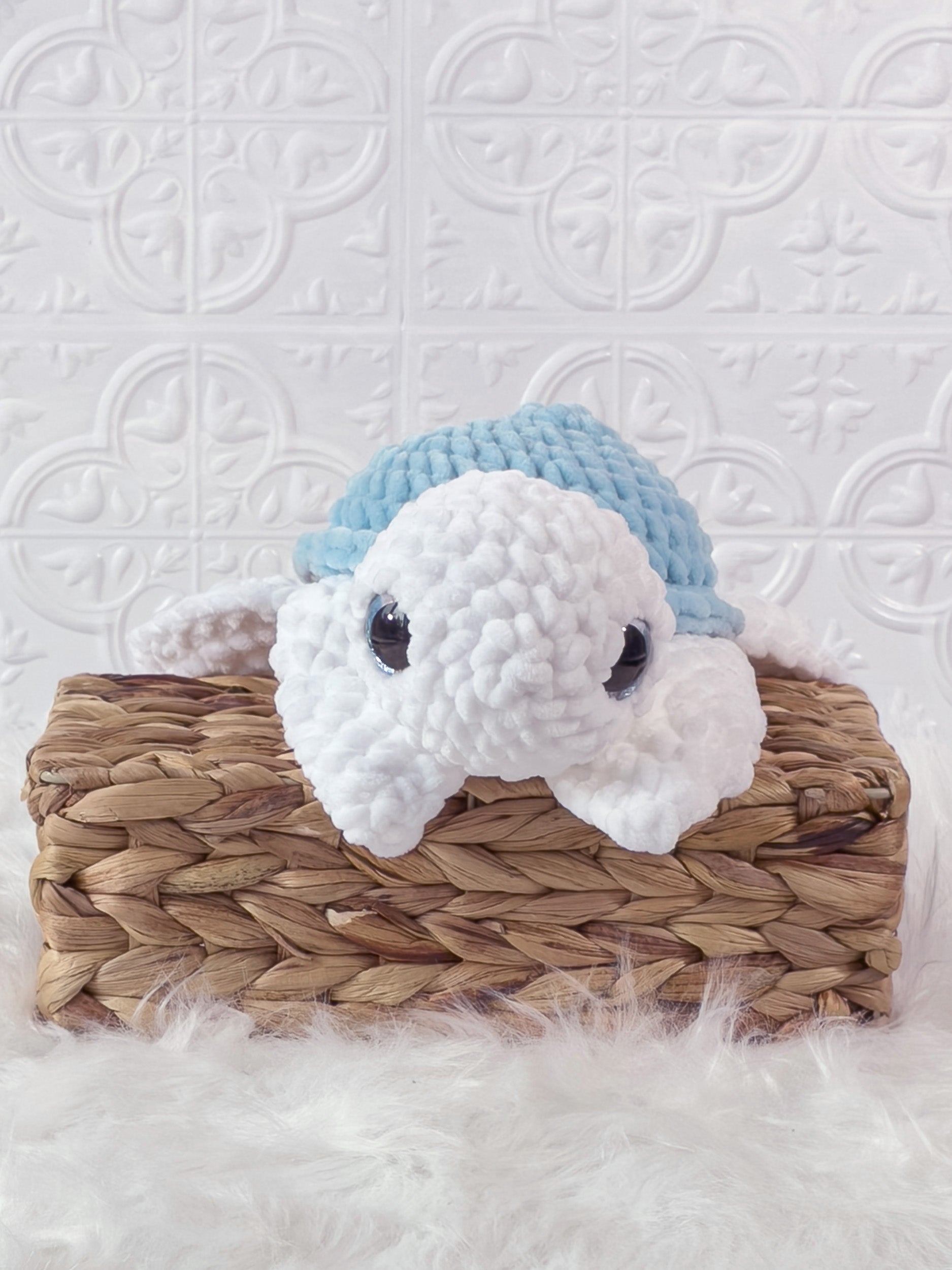 Handmade blue turtle crochet plushie shown from the front