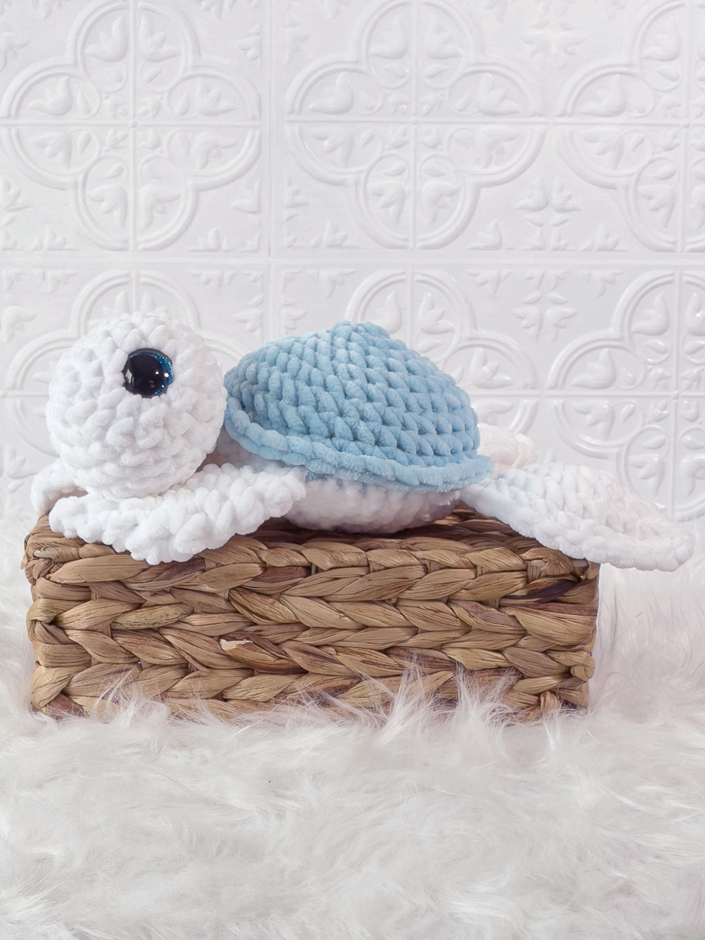 Handmade blue turtle crochet plushie shown from the side