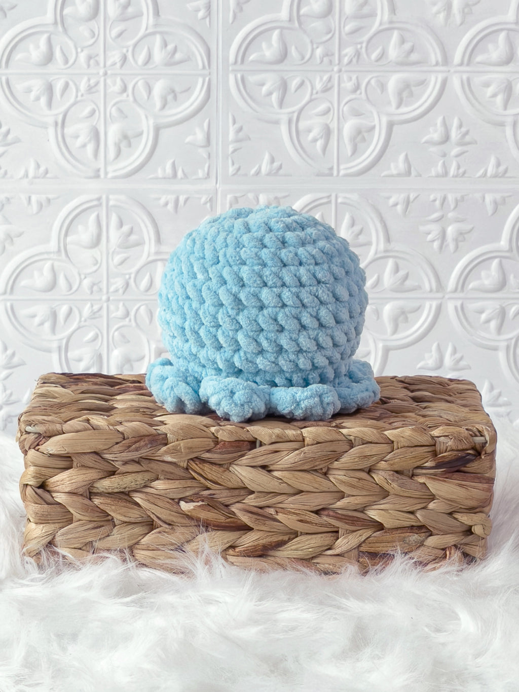Handmade blue octopus crochet plushie shown from the back