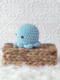 Handmade octopus crochet plushie shown from the front