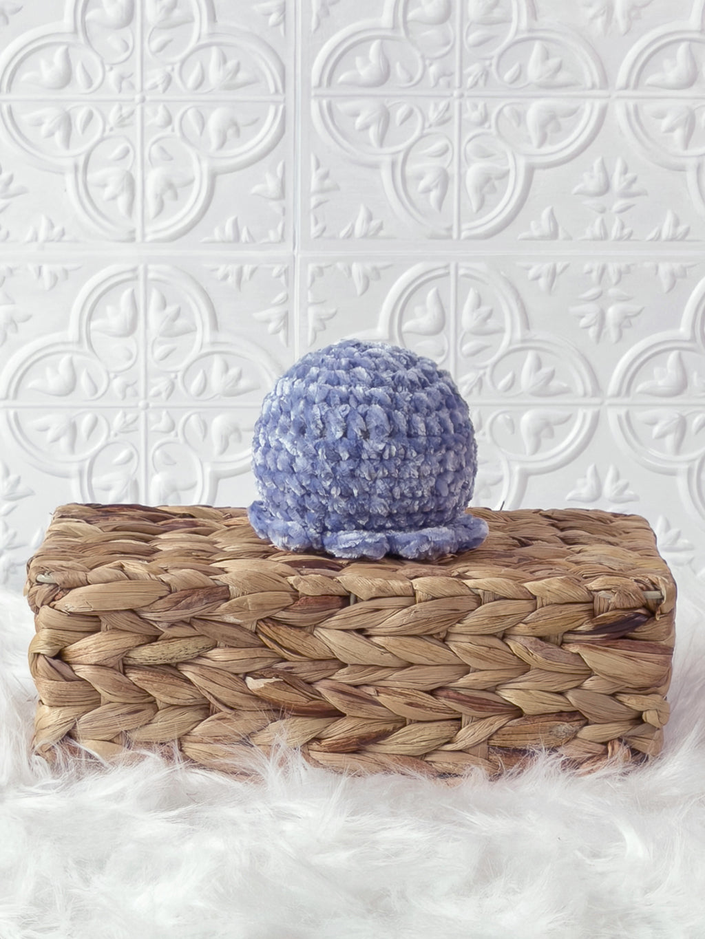 Handmade blue, light octopus crochet plushie shown from the back