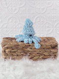 Handmade squid crochet plushie shown from the front
