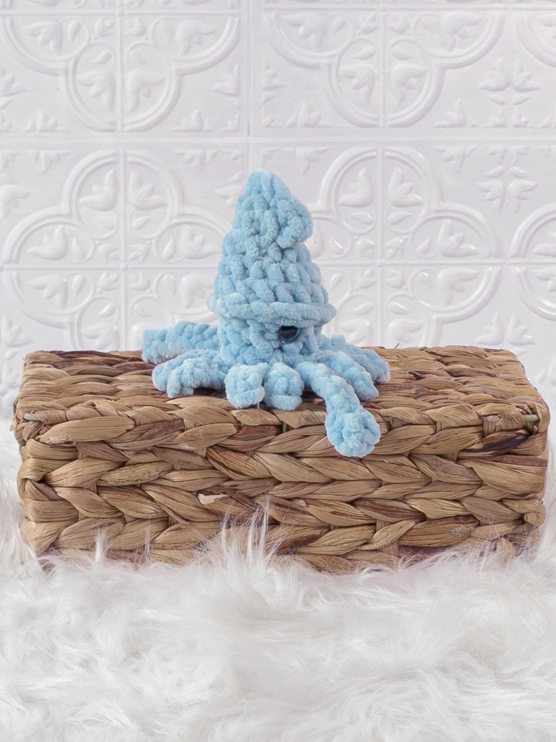 Handmade squid crochet plushie shown from the front