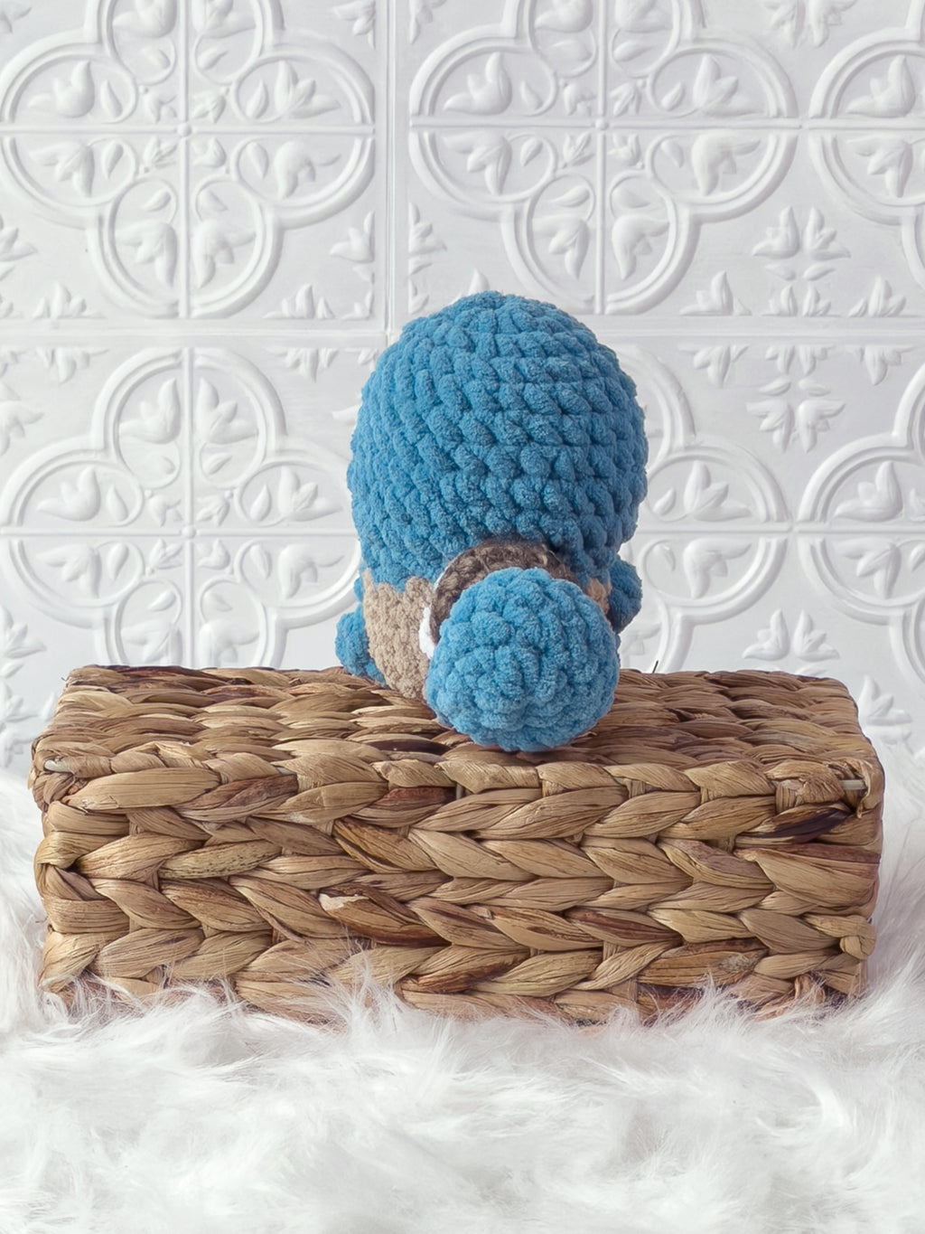 Handmade blue, light squirtle crochet plushie shown from the back