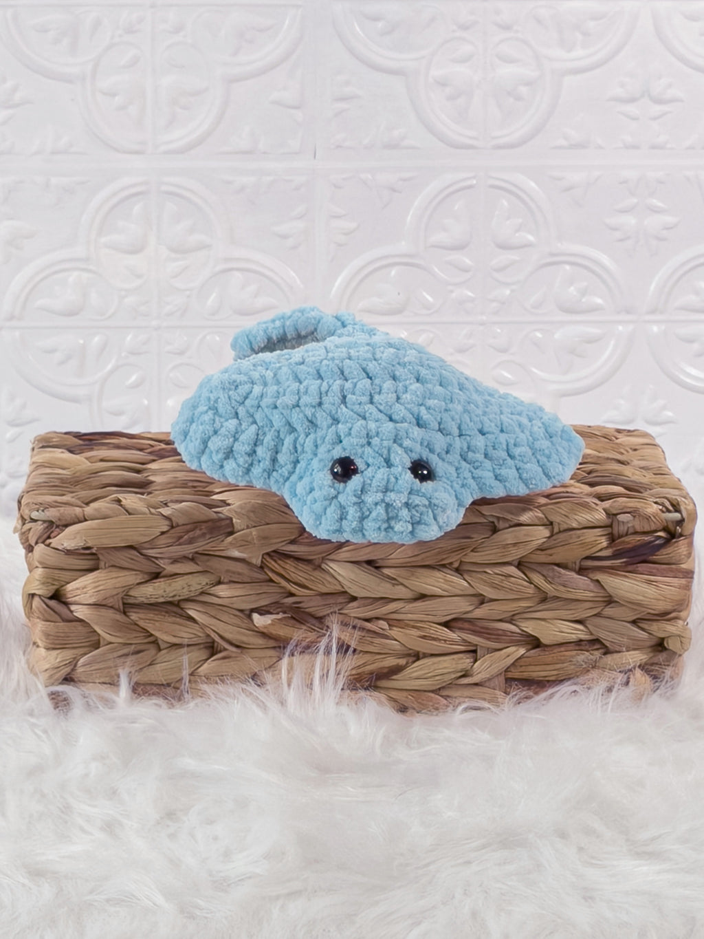 Handmade blue, light stingray crochet plushie shown from the front