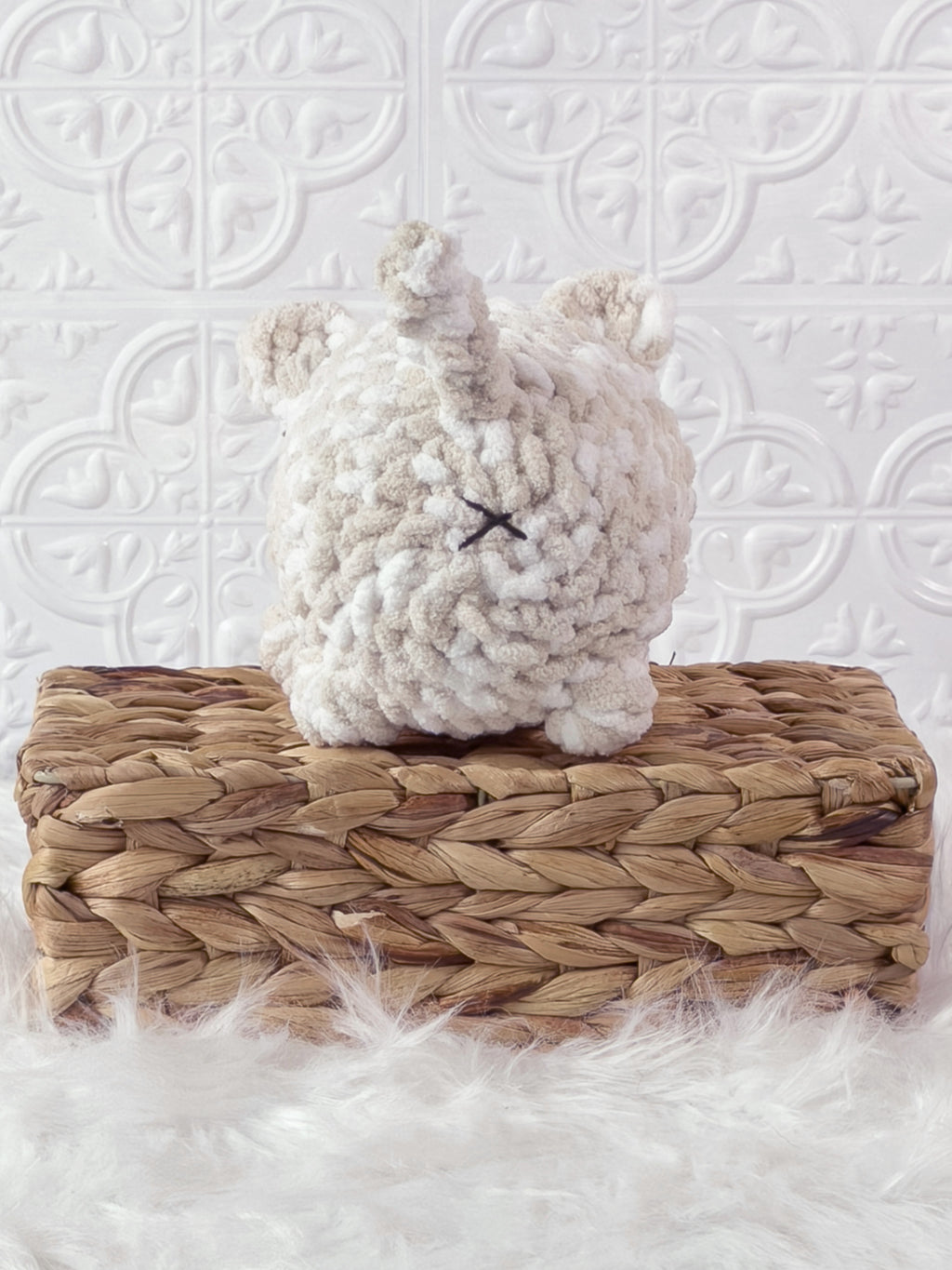 Handmade brown, cream big loaf cat crochet plushie shown from the back
