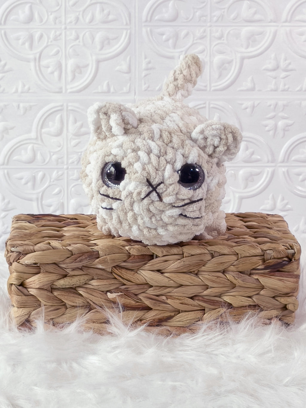 Handmade brown, cream big loaf cat crochet plushie shown from the front
