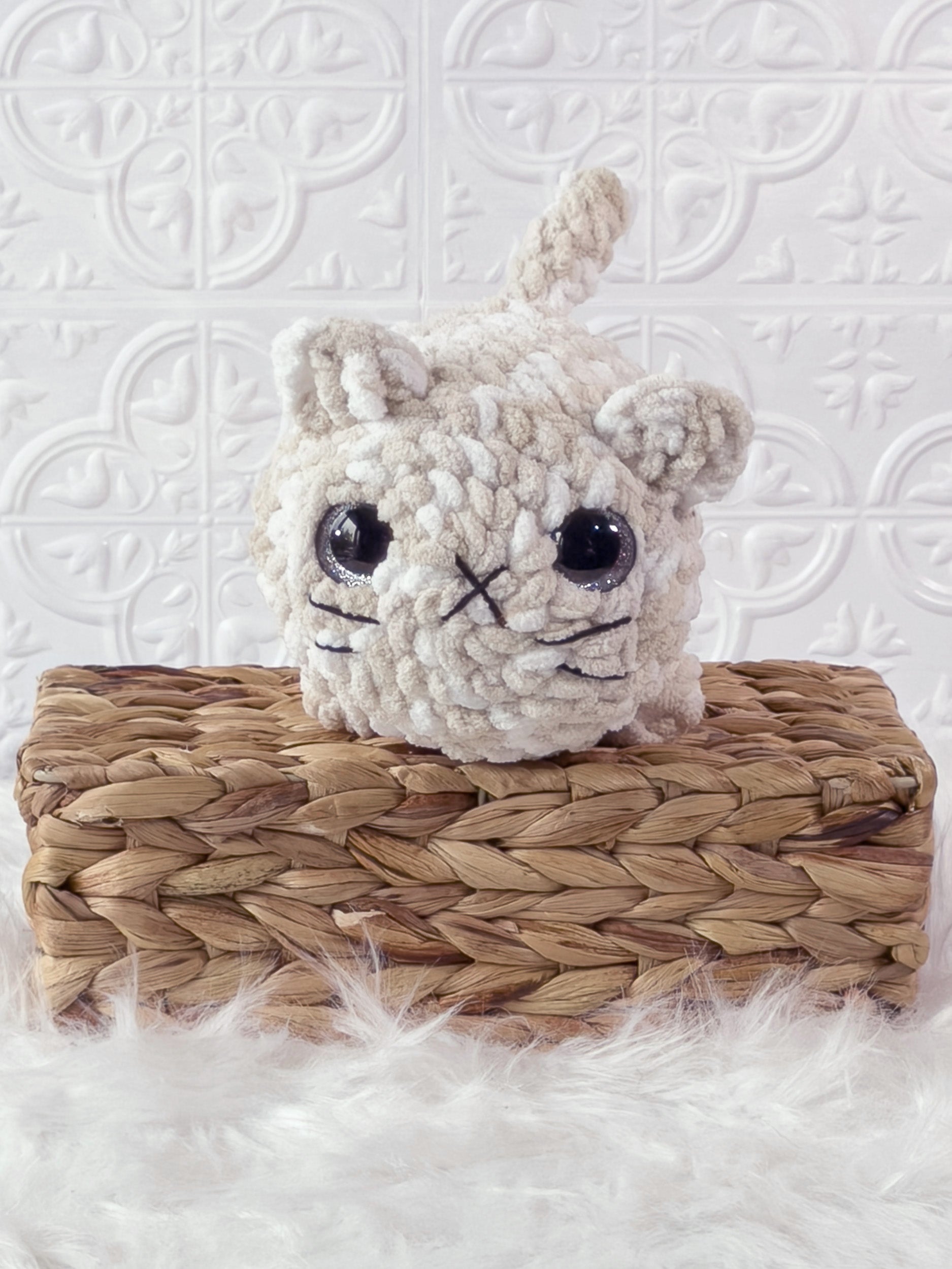 Handmade brown, cream big loaf cat crochet plushie shown from the front