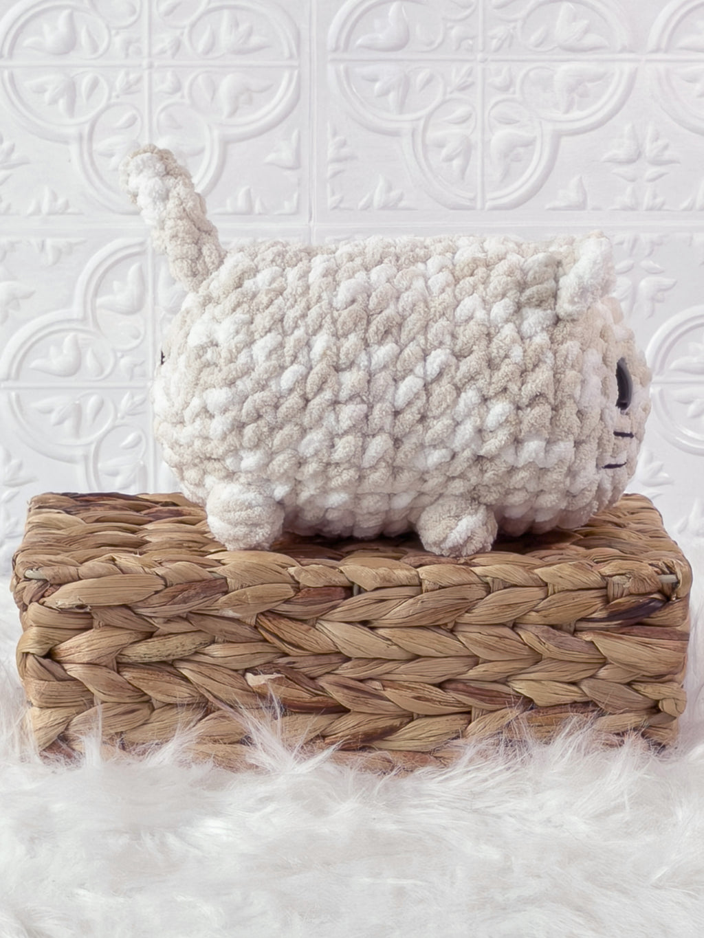 Handmade brown, cream big loaf cat crochet plushie shown from the side