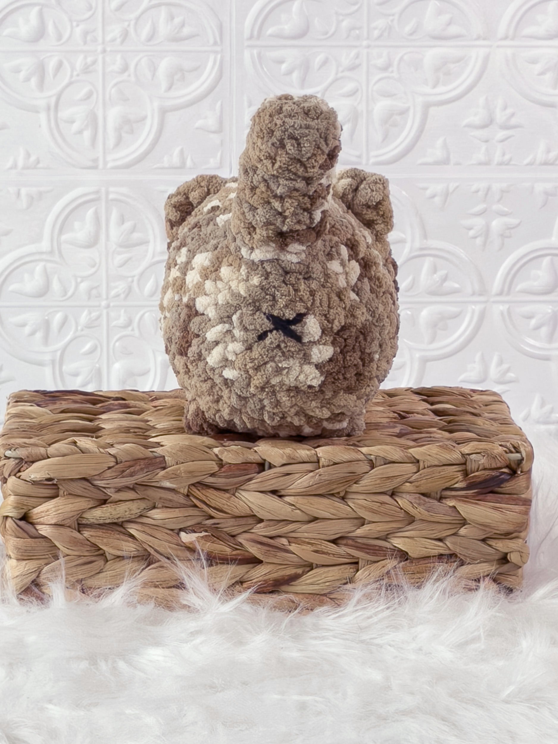 Handmade brown, dark big loaf cat crochet plushie shown from the back