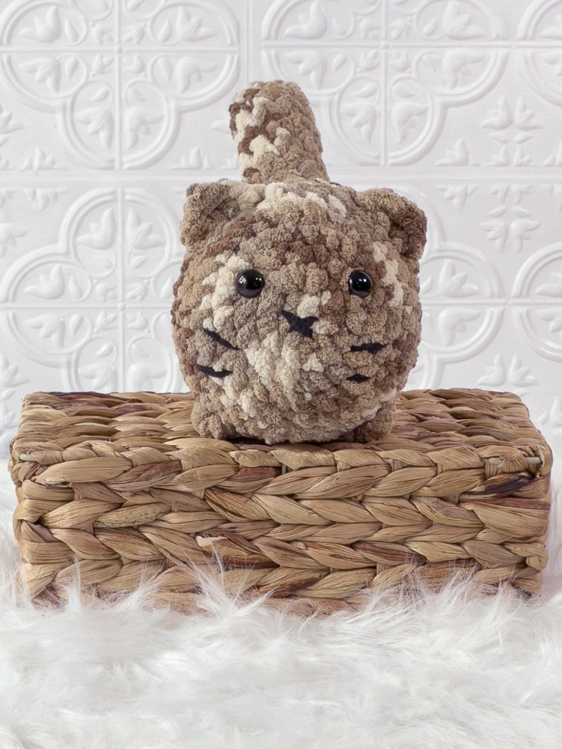 Handmade brown, dark big loaf cat crochet plushie shown from the front