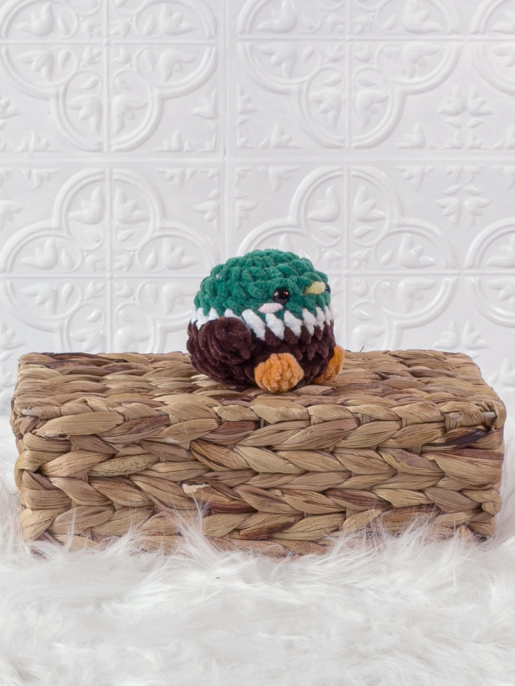 Handmade brown mallard crochet plushie shown from an angled view