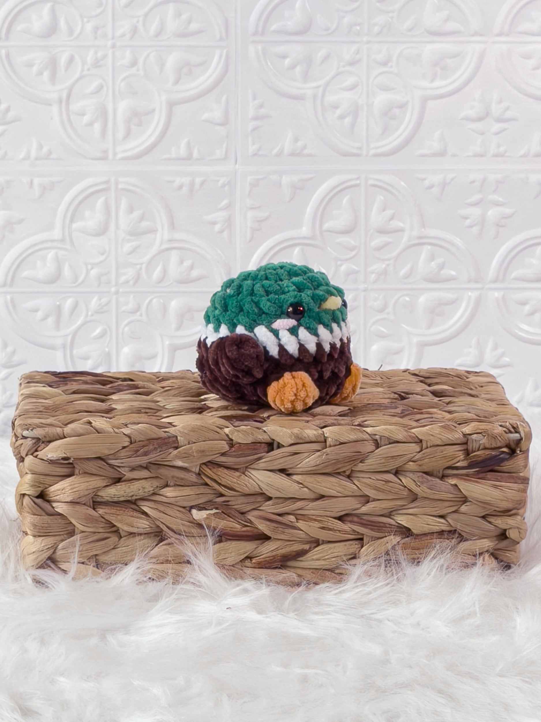 Handmade brown mallard crochet plushie shown from an angled view