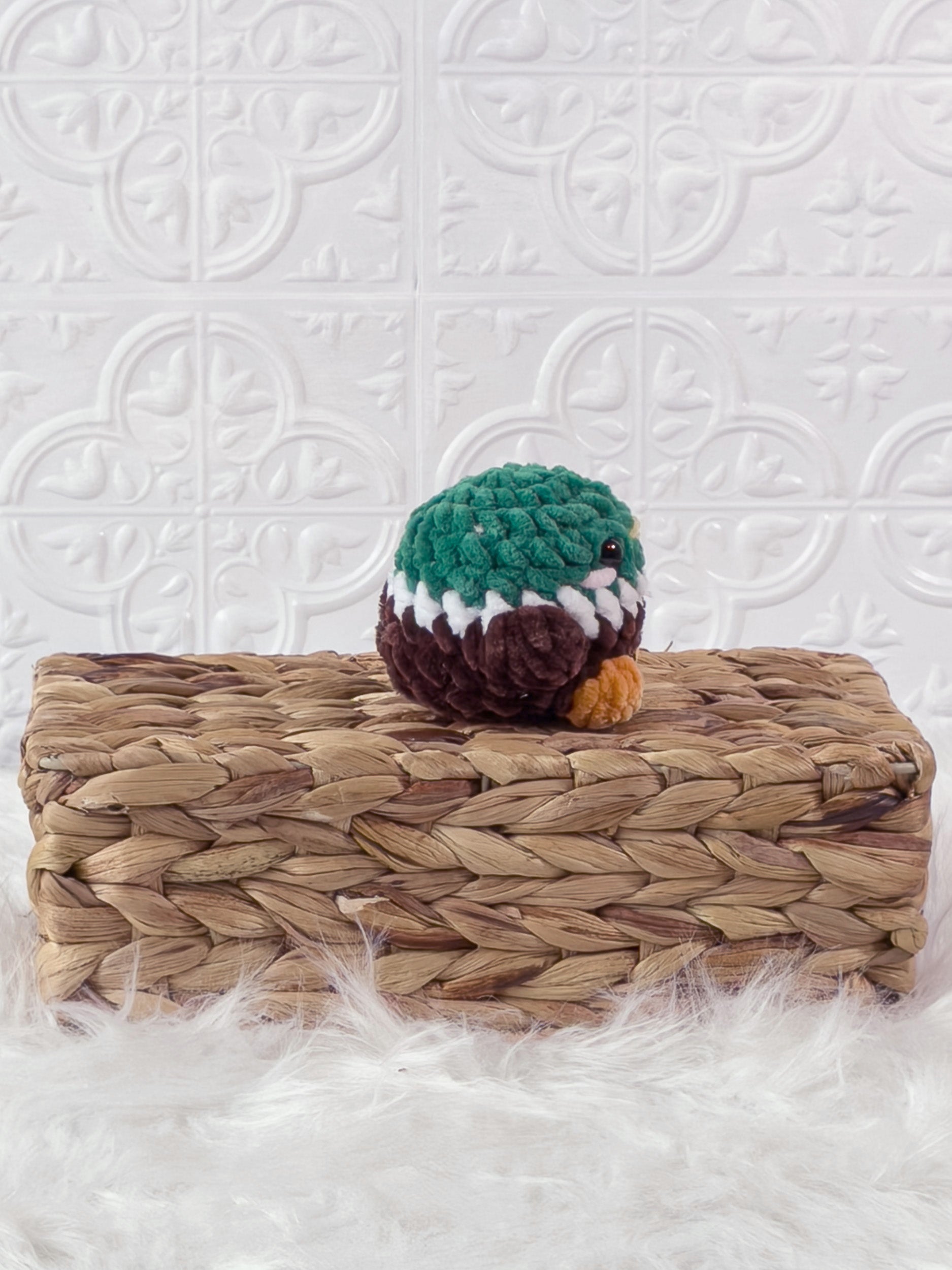 Handmade brown mallard crochet plushie shown from the side