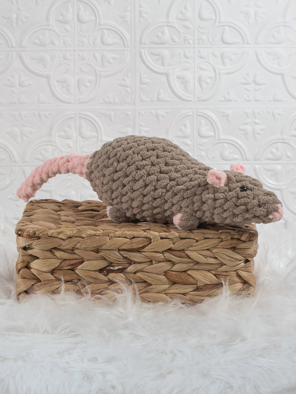 Handmade brown rat crochet plushie shown from an angled view