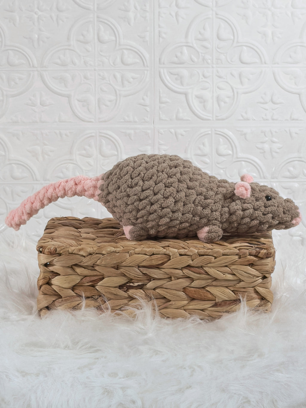Handmade brown rat crochet plushie shown from the side