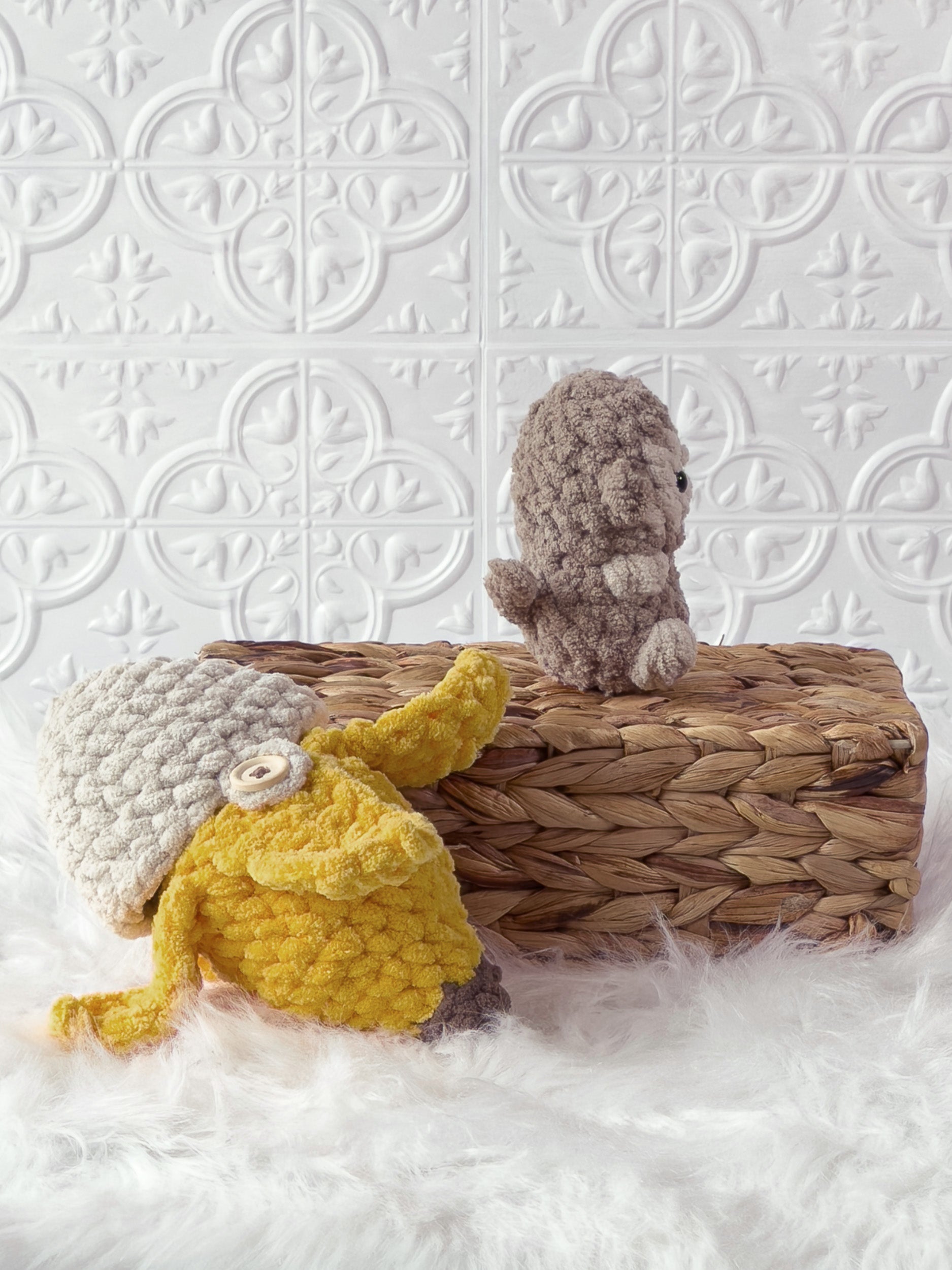 Handmade brown, yellow peek a boo monkey in banana crochet plushie shown from the side